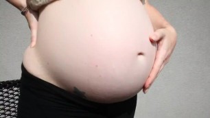 Pregnant Woman Playing with her Belly