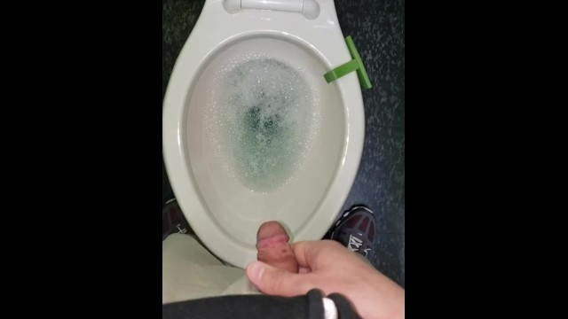 Pissing in a Clean Spotless Toilet with Blue Cleaner at Work