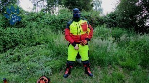 Forest Worker Pup pawing off in gear and boots (outdoors)
