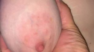 Playing with her big saggy tits