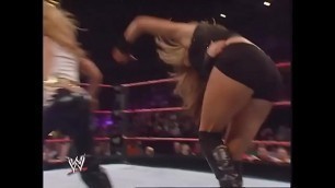 Mickie James faces Maria while dressed as Trish Stratus&period; Raw 2006&period;