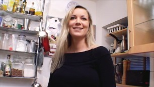 Outstanding German MILF with huge boobs dildoing her shaved muff in the kitchen